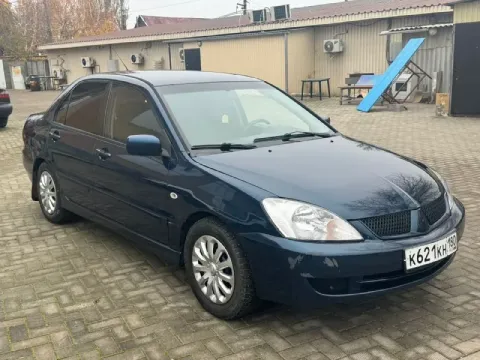 Mitsubishi лансер 9 2004 года двигатель 1.6 коропка ат не димит масло не расходует карапка работает ... - фотография