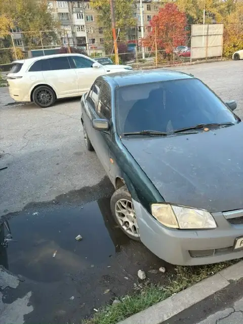Продам mazda 323 2000г. Диски, зимняя резина, 16-кл. Едет нормально, можно заняться топливной - буде... - фотография
