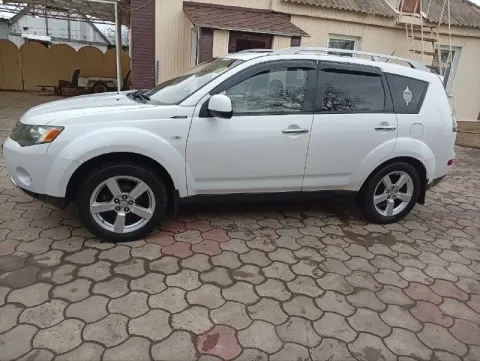Mitsubishi аутлендер 2007 г. V-6 объём 3 л. Подключаемый полный привод. Пробег 240 тыс. Автомат. Под... - фотография