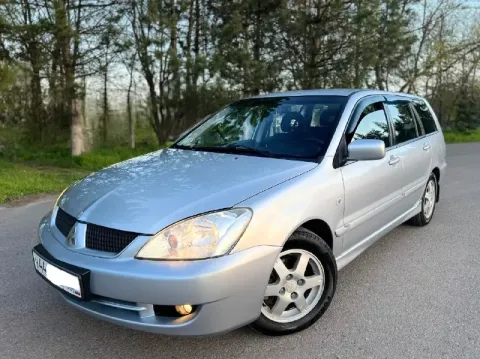 Продам mitsubishi lancer lx рестайлинг в состоянии близко к новому автомобилю! 1.6л. бензин. мкпп. с... - фотография