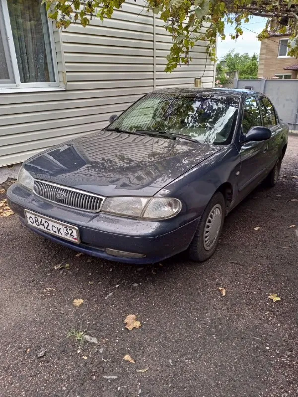 Продам киа кларус 2.0 1997г. , полностью на ходу. Заниматься нужно только по кузову. Лобаш под замену. Отдам 2 новых зимних ската, и новое стекло. Собственник. Доки чистые. Продажа по дкп. 100 000 р. Без торга. Г. Мариуполь. +79493307026(телега, ватсап). - фотография - 2