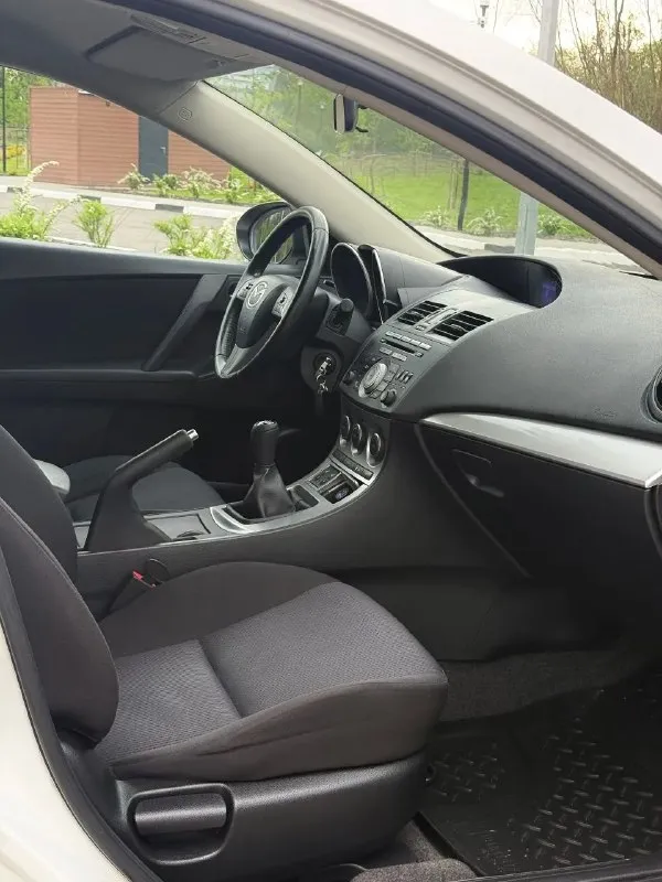 В продаже mazda 3, 2010 г. В, 1.6 л, 105 л. С, мкпп. Один собственник все 16 лет, одна запись в птс.

Кузов без следов коррозии, соответствует фото.

Комплектация - двухзонный климат с круизом, датчик дождя / света, мультируль, складывание зеркал, подогревы сидений, зеркал и лобового, штатный парктроник, омыватель оптики, линзы, датчики ebd, bas, abs, esp и прочие навороты. Стоит автозапуск, два родных ключа и т. Д и т. П.

Техосмотр пройден, авто готово к оформлению. Цена - 750,000 рублей. Рассрочки и обмена нет. Территориально находится в г макеевка (центр) контакты : +7(949)003-33-27, +7(979)028-27-27 - фотография - 10