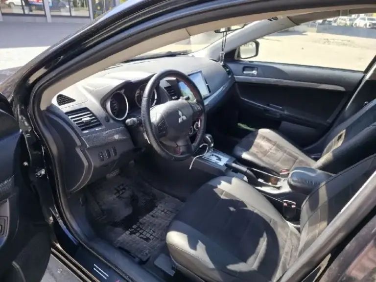 Продам mitsubishi lancer x
2008 Год, 1.8, акпп
Пробег 211 000.

Юридически чистая. Переоформление без проблем.

По технике порядок. Мотор порядок, коробка порядок. Все кнопки работают.

Комплектация: мультируль, круиз, автосвет, датчики дождя, усилитель руля, электрорегулировка зеркал, все 4 стеклоподъёмника.
В машине много чего сделано, т. К. Делал для себя, денег не жалел.
Стоит хорошая андроид магнитола с andoid auto и carplay.
Стоит дорогая, хорошая музыка. Новые динамики, сабвуфер от sony в багажнике, новый усилок.  
Установлен регистратор, камера заднего вида.
Стоит проекция на лобовое.
Климат работает (холодит и греет как надо).
Салон красивый, опрятный. Новые дорогие чехлы кожа+алькантара. Качественно перешит руль.
Сигнализация starline с автозапуском. Работает как часы.
Подушки на месте. Abs, esp.
2 Комплекта колёс. +запаска целая. Лето на дисках, зима штампы. Резина год назад бралась новая.

Сделана шумоизоляция капота, переднего правого подкрылка. (на второй подкрылок не успел поставить, времени не хватило. Весь комплект шумки в 3 слоя и инструменты для него отдам.
С машиной ещё много всего в довесок прилагается. От мелочей до разнообразных запчастей.

По кузову есть возрастные косяки. На фото все видно.

Цена: 650.000 р.
Продажа срочная, хороший торг у капота.

Осмотр днр, г. Донецк.
Подробности по телефону:
Роман
Феникс: +7-949-699-48-13
Мтс: +7-985-007-41-97 
Телеграм: @pyke666 / +79850074197 - фотография - 7