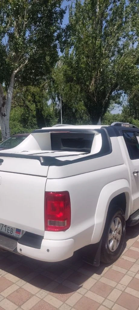 Фольксваген амарок. год выпуска - 2012. объем 2.0 битурбодизель, мкп. пробег 187 000 км. автомобиль был приобретен в 2016 году. по птс - вы будете вторым владельцем. автомобиль на 180 регионе, без штрафов и запретов, любые проверки за ваш счет, переоформление в мрэо. авто в отличном состоянии для своих лет. два года назад полностью обработано днище антикорозийкой. выкрашена в раптор. 50 км назад заменены масла, фильтра, ремни, произведено регламентное то. в дтп не участвовал. дополнительно стоит камера заднего хода, сигнализация "пандора". салон ухоженный и не прокуренный. могу рассмотреть обмен на авто с акп. седаны и лифтбэки, не предлагать. , а также машины старше 2014 года выпуска. разумный торг возле авто реальному покупателю. цена 2200000 рублей. телефон +79495550055. есть телеграмм. - фотография - 5