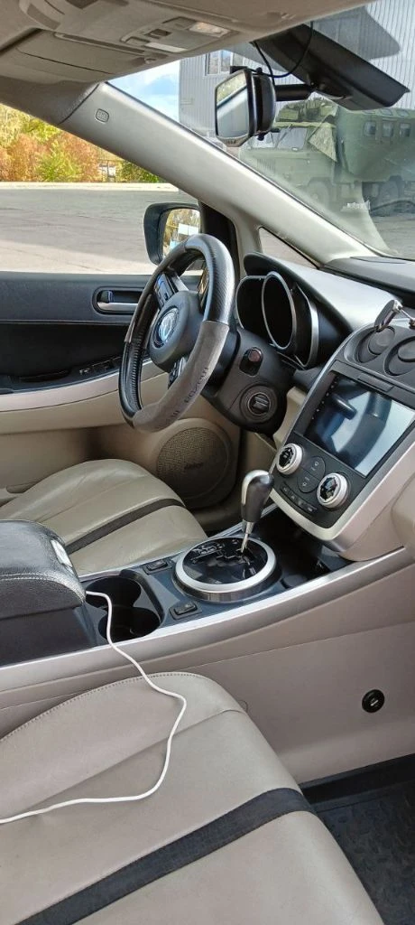 Продам мазда cx-7, мотор 2.3 л, турбо, 248 л. с., 2007 год. максимальная комплектация: кожаный салон, подогревы и электрорегулировка сидений, датчик дождя и света, электрозеркала с подогревом, музыка bose, android магнитола, бесключевой доступ, парктроники. по авто: 1) перебрана ходовая, новые тормозные диски и колодки (заменены в круг); 2) двигатель и коробка работают без нареканий, заменены масла в двигателе и коробке, раздатке, редукторе; 3) заменен компрессор кондиционера (новый) номер для звонков: +79490226487 - фотография - 9